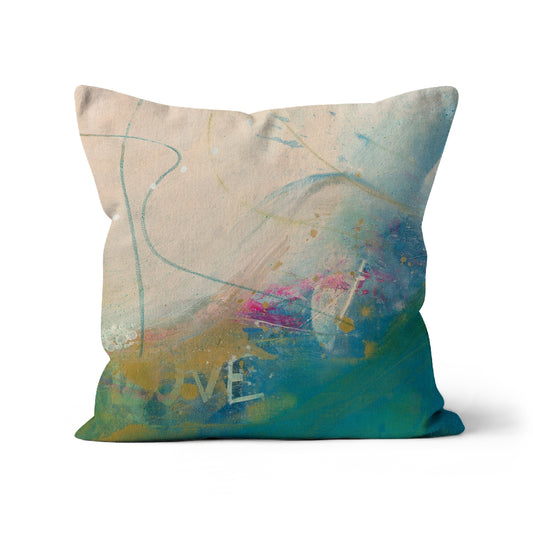 Moonstone cushion with the word love and splashed of pink amongst the blues and creams