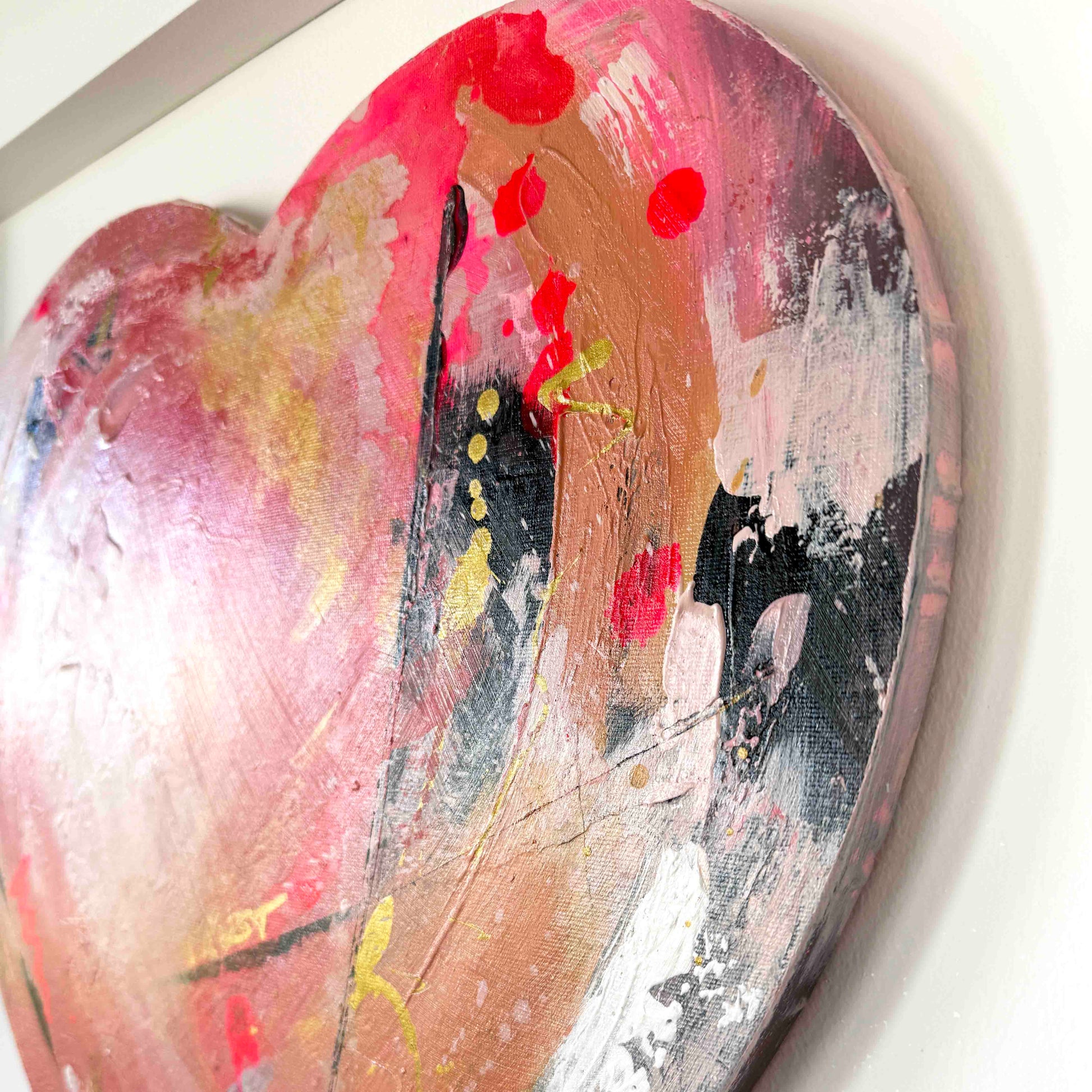 Abstract heart painting in pinks and golds